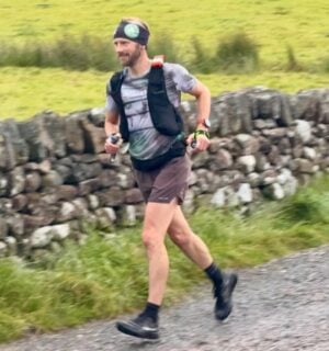 Photo shows vegan runner Damian Hall competing in the Lakeland 100 earlier this year