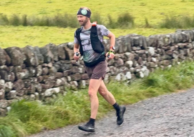 Photo shows vegan runner Damian Hall competing in the Lakeland 100 earlier this year
