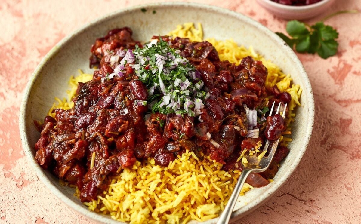 a bowl of Afghan-style bean curry over yellow basmati rice