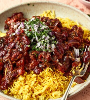 a bowl of Afghan-style bean curry over yellow basmati rice