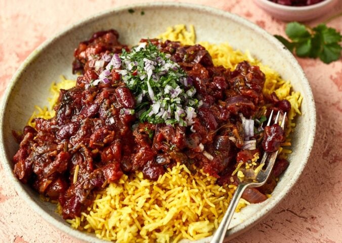 a bowl of Afghan-style bean curry over yellow basmati rice