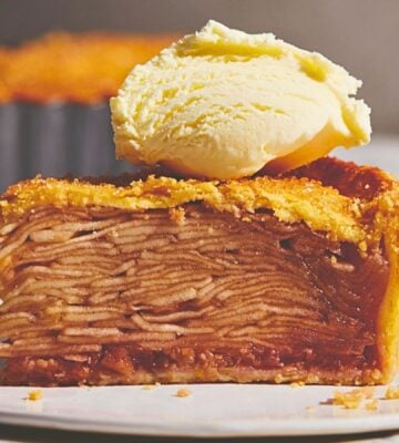 plant based apple pie with vegan flaky crust topped with vegan cream or ice cream for plant-based classic USA recipes
