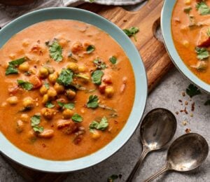 chickpea masala tomato soup with chili, coconut milk, and curry spices