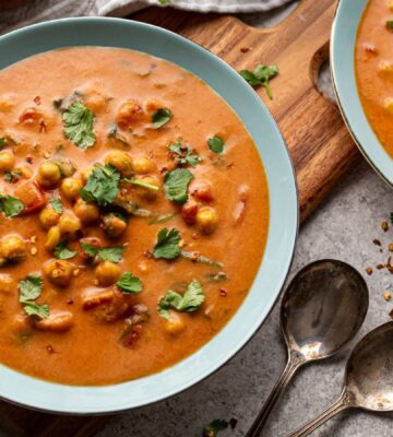 chickpea masala tomato soup with chili, coconut milk, and curry spices