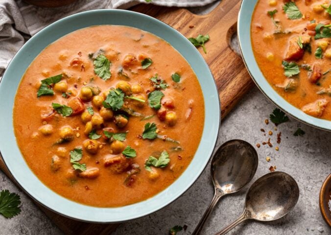 chickpea masala tomato soup with chili, coconut milk, and curry spices