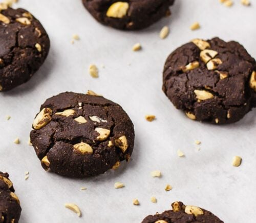 chocolate peanut cookies with almond flour, oats, nut butter, and raw peanuts