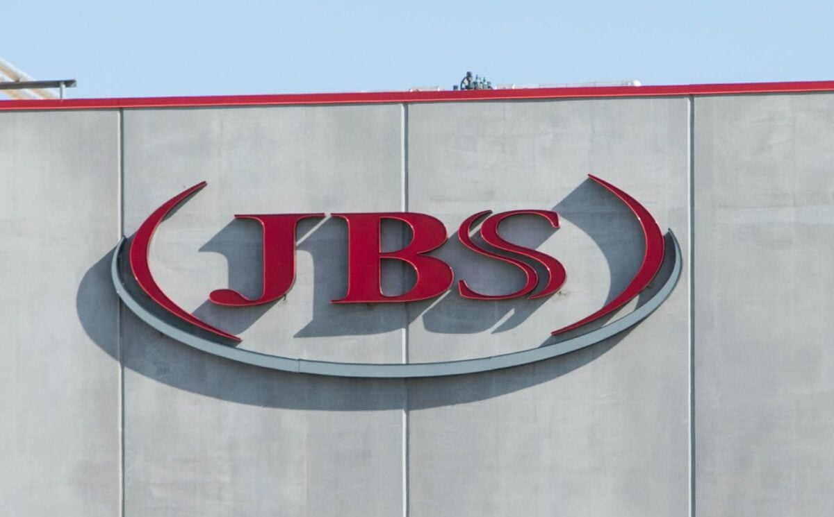 Photo shows the JBS logo in red on the front of a large grey building. JBS is launching a new plant-based collective