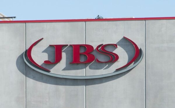 Photo shows the JBS logo in red on the front of a large grey building. JBS is launching a new plant-based collective
