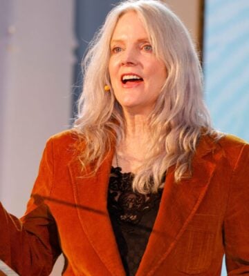 Photo shows Maggie Baird, founder of plant-based food advocacy nonprofit Support + Feed, speaking at the annual Captain Planet Foundation Gala in Atlanta earlier this year