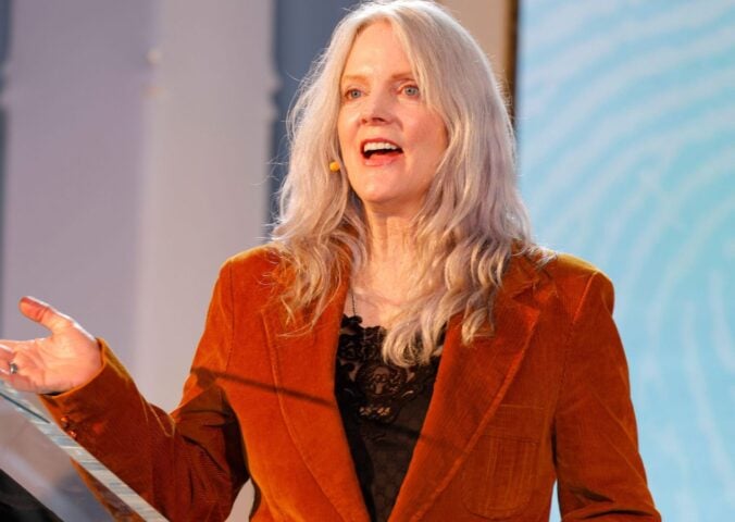 Photo shows Maggie Baird, founder of plant-based food advocacy nonprofit Support + Feed, speaking at the annual Captain Planet Foundation Gala in Atlanta earlier this year