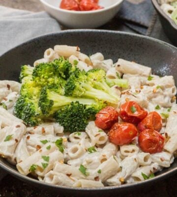 a bowl plant based alfredo sauce made with cashews and miso, served with pasta