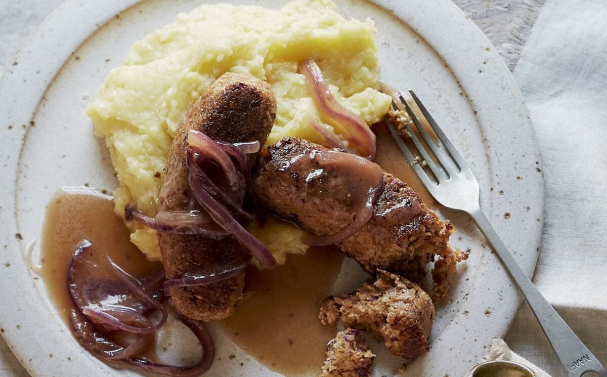 vegan sausage and mash made of walnuts, bread, and onions, served with creamy mash