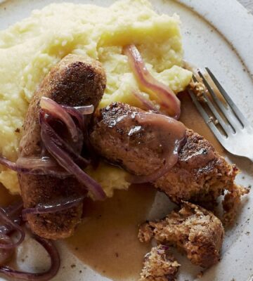vegan sausage and mash made of walnuts, bread, and onions, served with creamy mash