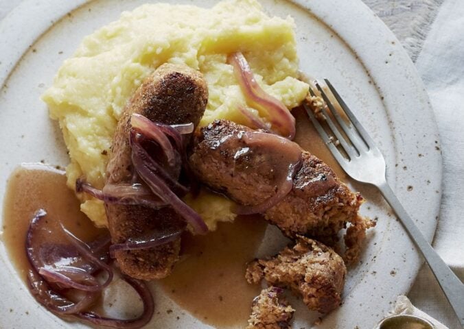 vegan sausage and mash made of walnuts, bread, and onions, served with creamy mash