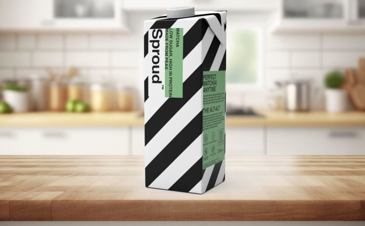 Photo shows a carton of Sproud's new matcha-flavored pea milk on a background featuring a kitchen worktop