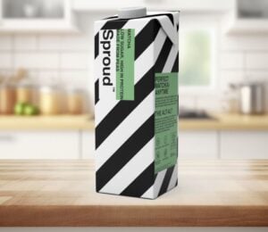 Photo shows a carton of Sproud's new matcha-flavored pea milk on a background featuring a kitchen worktop