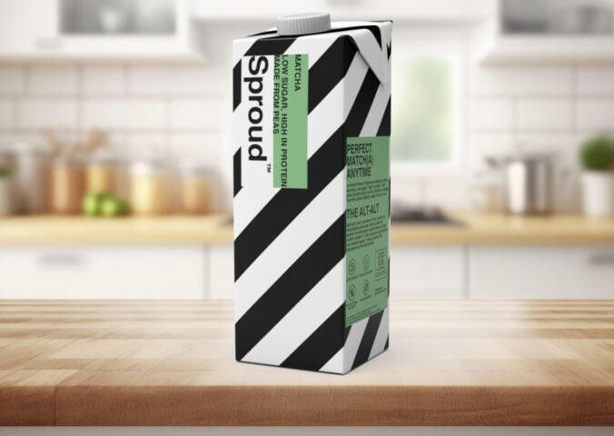 Photo shows a carton of Sproud's new matcha-flavored pea milk on a background featuring a kitchen worktop