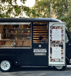 Photo shows a small doughnut van - here's how to start a vegan food truck
