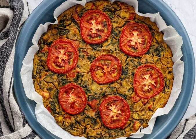 vegan gluten-free quiche florentine with nutritional yeast, veggies, and spices