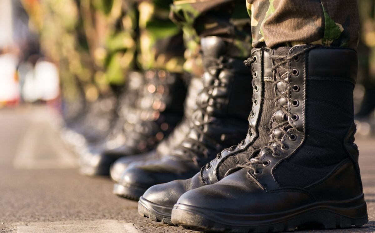 Photo shows the boots of soldiers standing in a row at attention. Britain's RAF soldiers will now have access to vegan uniforms