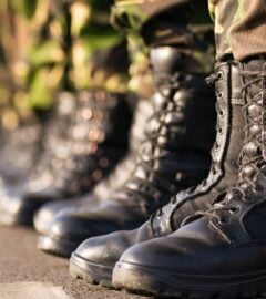 Photo shows the boots of soldiers standing in a row at attention. Britain's RAF soldiers will now have access to vegan uniforms