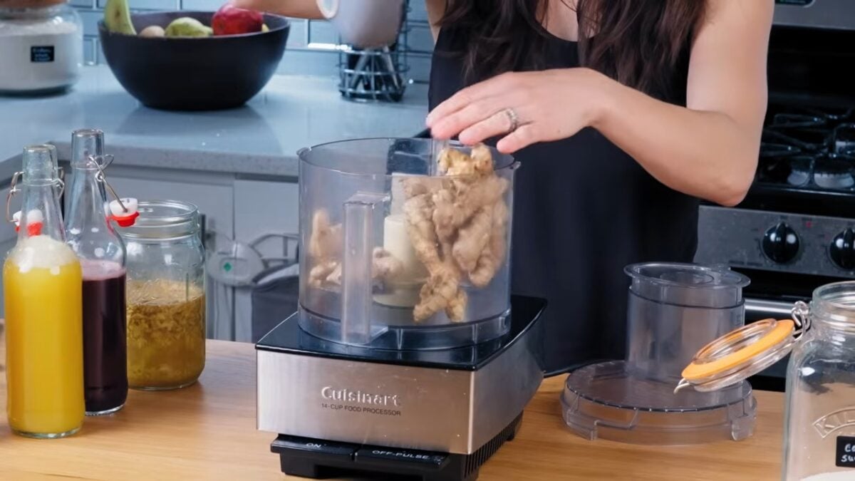 To make her homemade probiotic soda, Cameron Rodas places ginger in her food processor