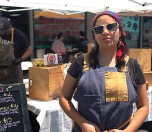 Violeta, one of several Latino chefs in California featured on Rated V for Vegan, speaks about blending culture and vegan cuisine at a local vegan market