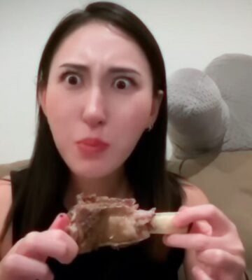 Perfect Carnivore influencer Steak and Butter Gal eating meat off a bone, promoting her meat-only diet