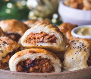 a plate of caramelized apple and red onion vegan sausage rolls
