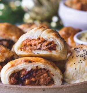 a plate of caramelized apple and red onion vegan sausage rolls