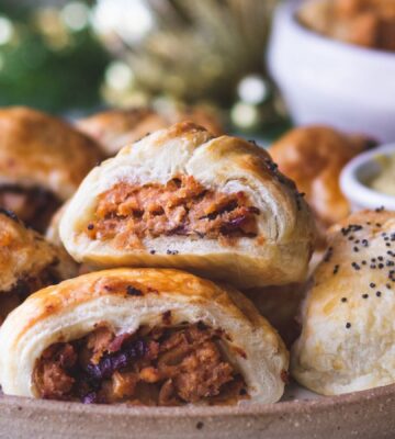 a plate of caramelized apple and red onion vegan sausage rolls