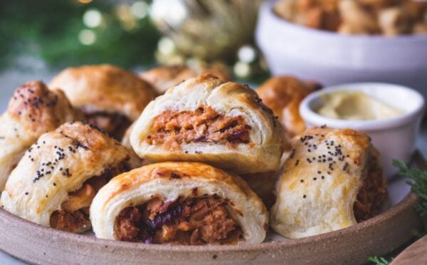 a plate of caramelized apple and red onion vegan sausage rolls