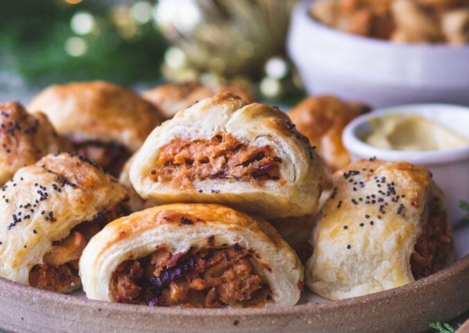 a plate of caramelized apple and red onion vegan sausage rolls
