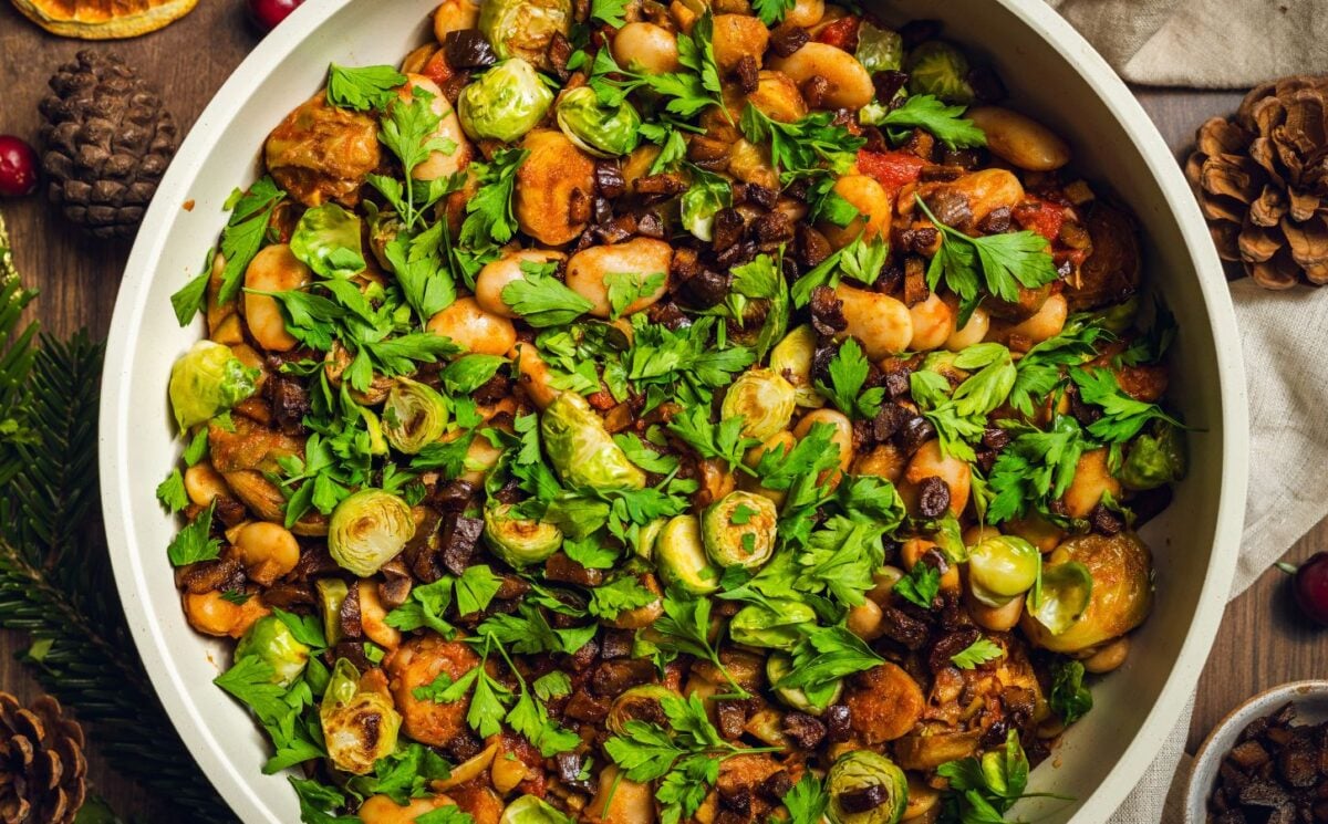 a bowl of chopped, caramelized sprouts with butter beans and chestnuts for high-protein fall recipes