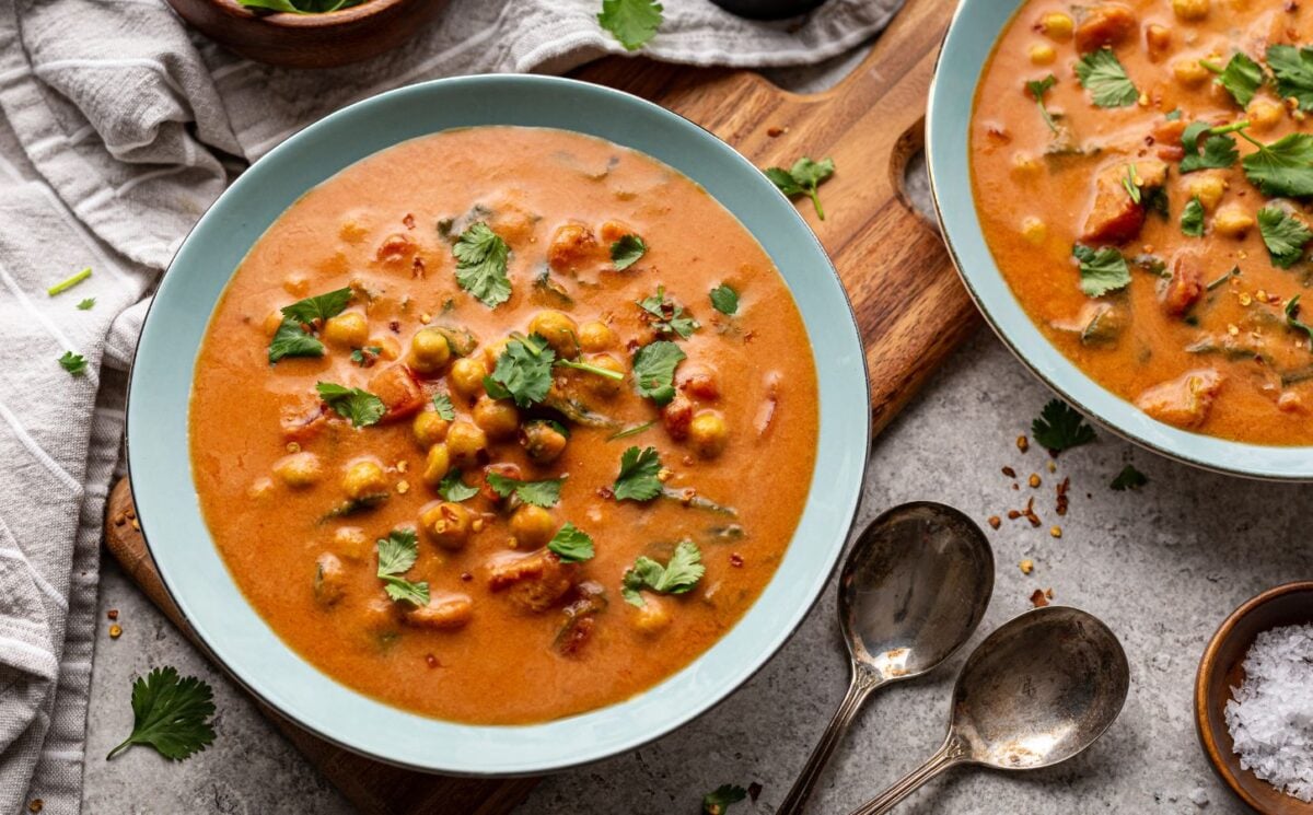 chickpea masala tomato soup with chili, coconut milk, and curry spices for vegan soup recipes