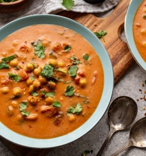 chickpea masala tomato soup with chili, coconut milk, and curry spices for vegan soup recipes