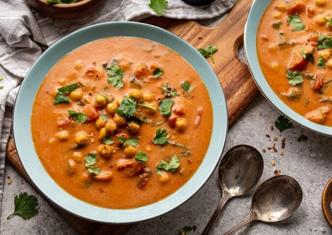 chickpea masala tomato soup with chili, coconut milk, and curry spices for vegan soup recipes