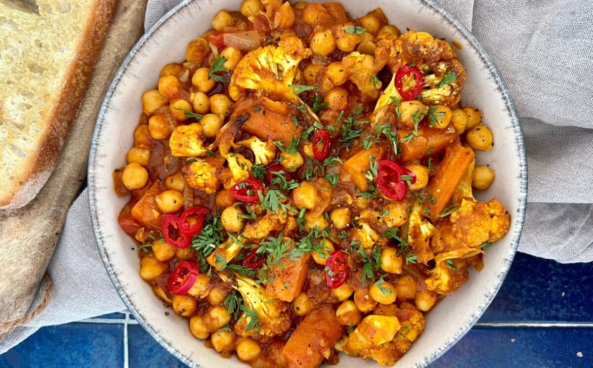 curried cauliflower and chickpea stew with tomato and curry spice