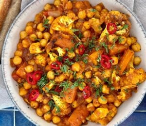 curried cauliflower and chickpea stew with tomato and curry spice