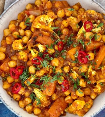 curried cauliflower and chickpea stew with tomato and curry spice