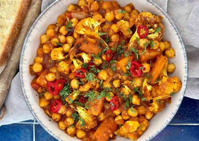 curried cauliflower and chickpea stew with tomato and curry spice