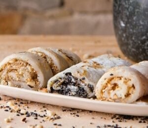 vegan fried mochi rolls with peanuts, walnuts, oats, and white and black sesame seeds