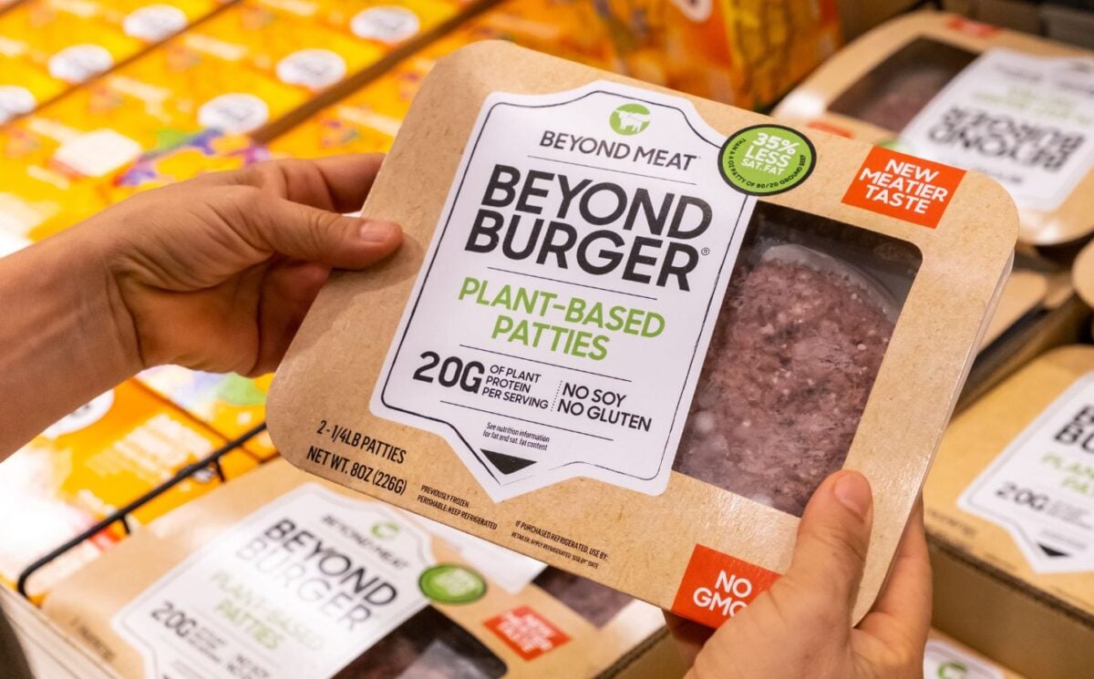 Photo shows someone's hands as they hold up a package of Beyond Burgers. "Burger" and other meat words may soon be banned from plant-based food labels in Europe