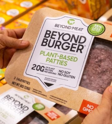 Photo shows someone's hands as they hold up a package of Beyond Burgers. "Burger" and other meat words may soon be banned from plant-based food labels in Europe