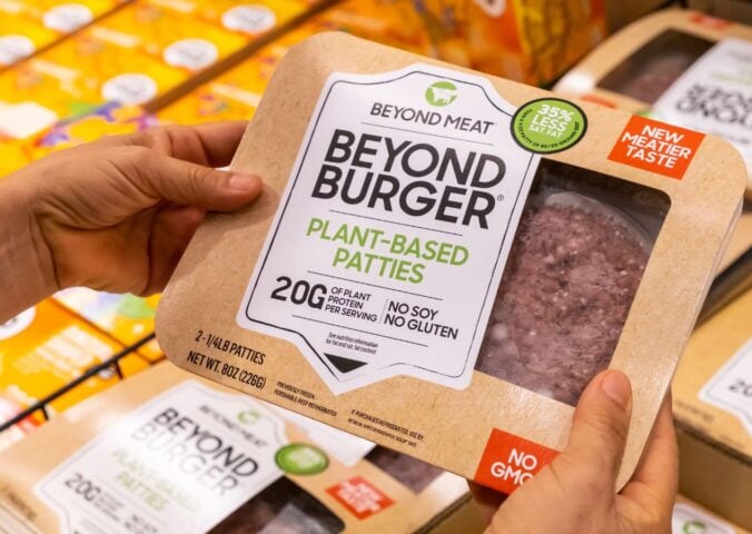 Photo shows someone's hands as they hold up a package of Beyond Burgers. "Burger" and other meat words may soon be banned from plant-based food labels in Europe