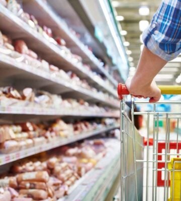 Photo shows someone with a shopping trolley in the meet aisle. Some plant-based proteins are currently cheaper than traditional meat