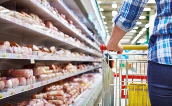 Photo shows someone with a shopping trolley in the meet aisle. Some plant-based proteins are currently cheaper than traditional meat