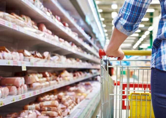 Photo shows someone with a shopping trolley in the meet aisle. Some plant-based proteins are currently cheaper than traditional meat