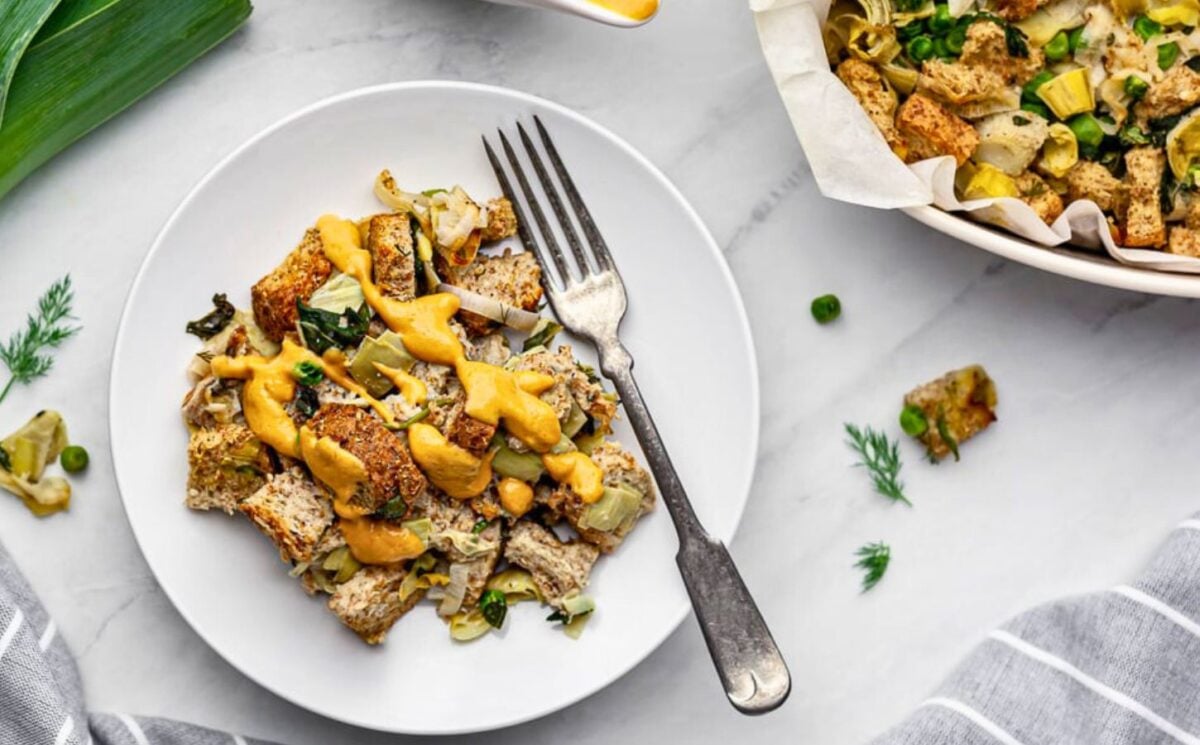 plant based savory bread pudding with nutritional yeast and spinach