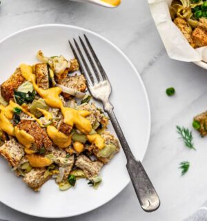 plant based savory bread pudding with nutritional yeast and spinach